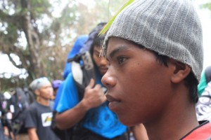 UNDERAGE PORTER. Ron, 15, waits for the group who hired him for their departure via the Kidapawan exit-trail. (davaotoday.com photo by Rawi June Amaga-Morandante)