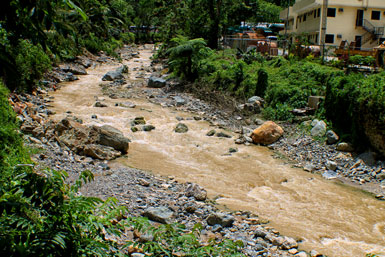 MURKY RIVER. What used to be clean and clear, the Masara river in Maco town, Compostela Valley has turned dark and dirty. Elders here said they used to catch a lot of fish for sustenance. But when the Apex Mining Corporation started its large-scale mining operation, they said, the river was destroyed and the fishes now gone. (davaotoday.com photo by Ace R. Morandante)