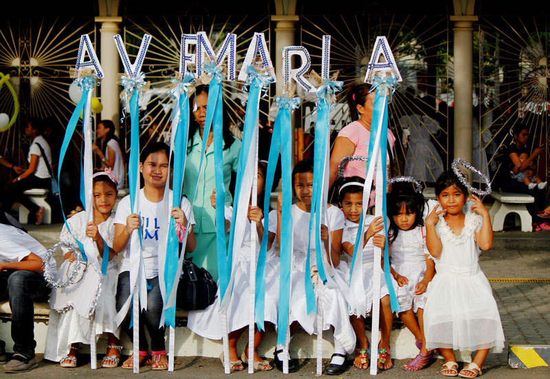 Children dressed as angels participate in Flores de Tagumeño.  (Contributed photo by Kits Quilla)