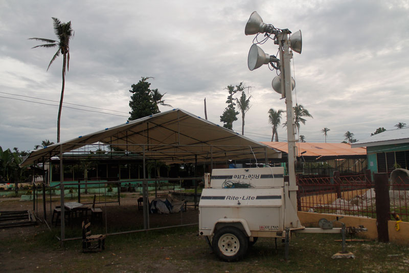 GENERATOR.  In Lambajon Central Elem School, the largest polling center in Baganga town, Davao Oriental, a generator for huge lamps is on standby.  Along with four other generator sets, this will power the five PCOS machines once the electricity shuts down.  (davaotoday.com photo by John Rizle L. Saligumba)