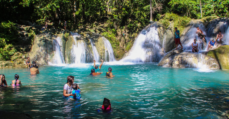 LAST DAYS OF SUMMER.  Local tourists, including children, relax and have fun at the Hagimit Falls in Peñaplata, Samal Island, Davao del Norte.  Albeit a small waterfall, one will enjoy the natural swimming pools and rock formations here.  (davaotoday.com photo by Jandy Ken C. Lizondra)