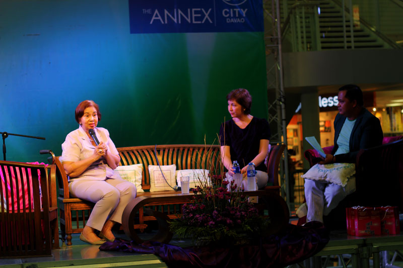 Two of Davao’s City’s pillars in the RH movement, Lyda Canson (left) and Dr. Darleen Estuart (middle), discuss women’s issues during the International Day of Action for Women’s Health at the SM Annex, March 28.  (davaotoday.com photo by Ace R. Morandante)