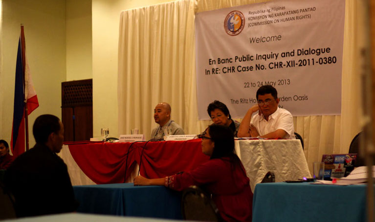 PRIME SUSPECT.  Jimmy Ato (facing CHR officials), one of the prime suspects in the killing of Italian priest Fr. Fausto Tentorio, denies any hand on the crime during the last day of the public inquiry led by the Commission on Human Rights Friday in Davao City.  (davaotoday.com photo by Ace R. Morandante)