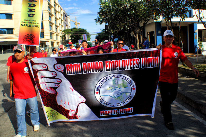 Employees of the Radio Mindanao Network join the 127th celebration of International Labor Day, Wednesday in Davao City.  (davaotoday.com photo by Ace R. Morandante)