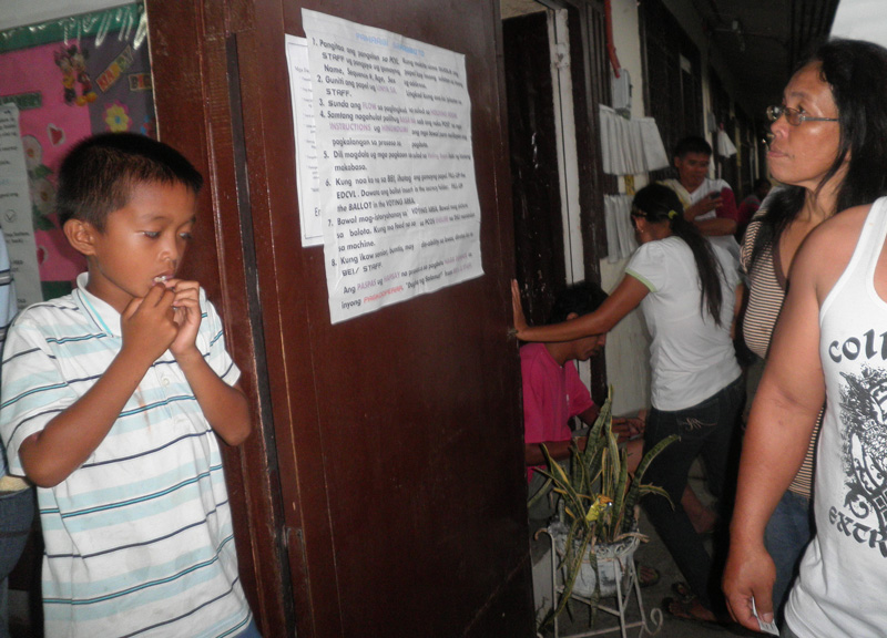 Printed reminders are posted outside the polling precincts in Don Ricardo Briz Elementary School.  (davaotoday.com photo by Mart D. Sambalud)