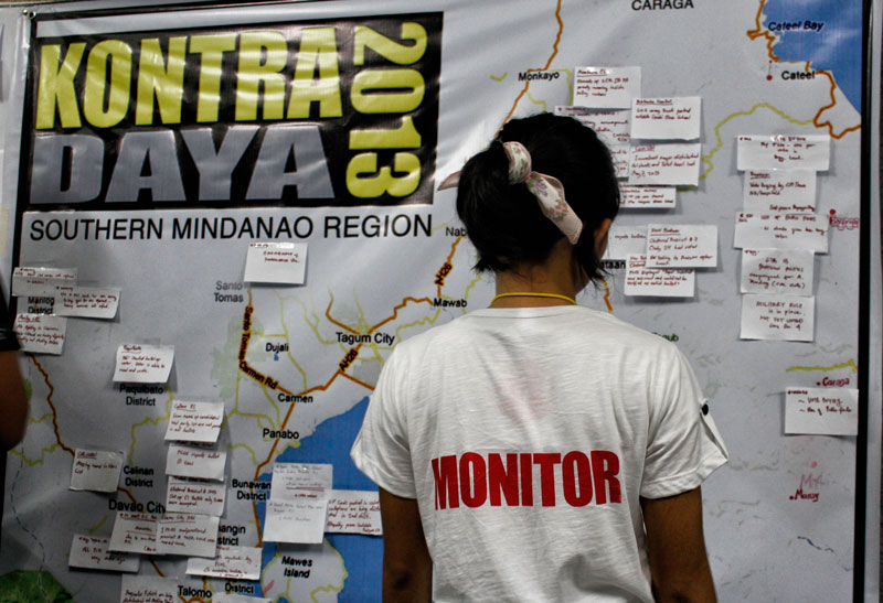 WATCHDOG.  A volunteer of poll watchdog Kontra Daya-Southern Mindanao records reports from their teams dispatched in the different areas in the region.  The group’s headquarters is located in Davao City.  (davaotoday.com photo by Medel V. Hernani)