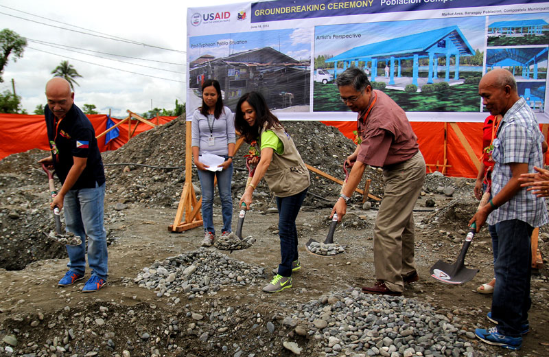 BAGSAKAN PROJECT.  Gloria Steele (in brown vest) of the United States Agency for International Development (USAID) leads the ground breaking ceremony of the new trading center in Poblacion village, Compostela town, Compostela Valley on Friday.  The project, designed to withstand extreme weather conditions, is worth PHP 2.5 Million and part of USAID’s disaster recovery assistance to the communities affected by typhoon Pablo.    (davaotoday.com photo by Ace R. Morandante)