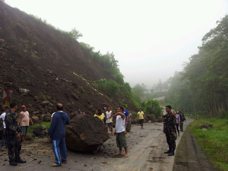 Boulders block part of this road in Kimadsil village, Carmen town following the 5.7 magnitude earthquake Saturday evening.  (photo courtesy of the Office of Governor Emmylou Taliño-Mendoza) 