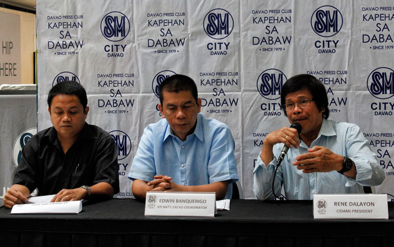 GROW COCOA, PLEASE.  Rene Dalayon (right), President of Cidami, encourages local farmers to plant cacao “to meet the global market challenge.”  He said production must be increased to 15,000 hectares per year to meet the required export volume.  The country currently produces 10,000 metric tons.  (davaotoday.com photo by Medel V. Hernani)