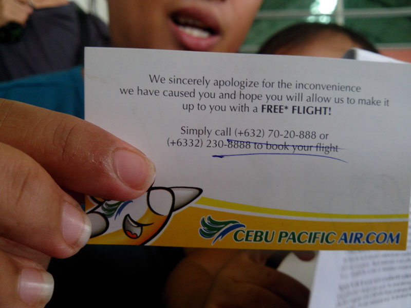 INCONVENIENCE.  A passenger shows the free flight card she received from Cebu Pacific Tuesday at the Francisco Bangoy International Airport in Davao City.  Irene Milla, who’s scheduled to fly back to Manila with her kids, aged 1 and 8, complained for the problems the airline company had caused them.  On Sunday evening, Cebu Pacific’s aircraft veered off the tarmac blocking all flights as of Tuesday afternoon.  (davaotoday.com photo by John Rizle L. Saligumba) 