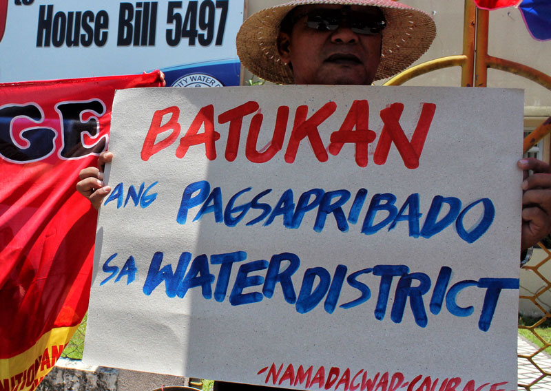 A member of Namadacwad protests the planned privatization of the Davao City Water District.  (davaotoday.com file photo by Medel V. Hernani)