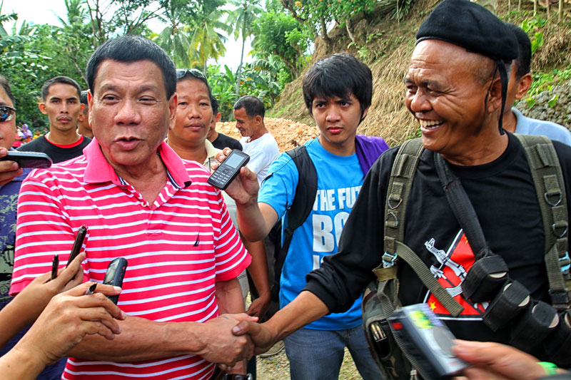 MAYOR MEETS GUERRILLA LEADER Davao City Mayor Rody Duterte jests with his “long friend” New People’s Army guerrilla Ka Parago saying he should be the next mayor of Davao or at least barangay captain of Paquibato. (davaotoday.com photo by Ace R. Morandante)