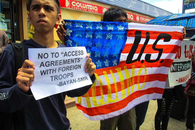NO TO US INTERVENTION.  “Access arrangement” with foreign troops is contrary to national sovereignty, national interest and the Constitution.  This was how members of the militant Bagong Alyansang Makabayan viewed the plan of the Aquino government as they protest Thursday in Davao City.  They slammed the plan of allowing US troops to make the country a temporary, worse permanent, base for the war on aggression through the “one-sided” Visiting Forces Agreement.  (davaotoday.com photo by Ace R. Morandante)