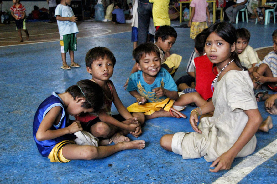 These Manobo children enjoy a moment in Bankerohan Gym, happy that they will be going home to Loreto, Agusan del Sur and at the same time happy that they were treated by concerned citizens to the beach in Toril.  Their families are guaranteed safety to return home after an agreement brokered by Davao City Mayor Rodrigo Duterte with Loreto Mayor Dario Otaza assured the pullout of troops and cease of military operations.  (davaotoday.com photo by Medel V. Hernani)