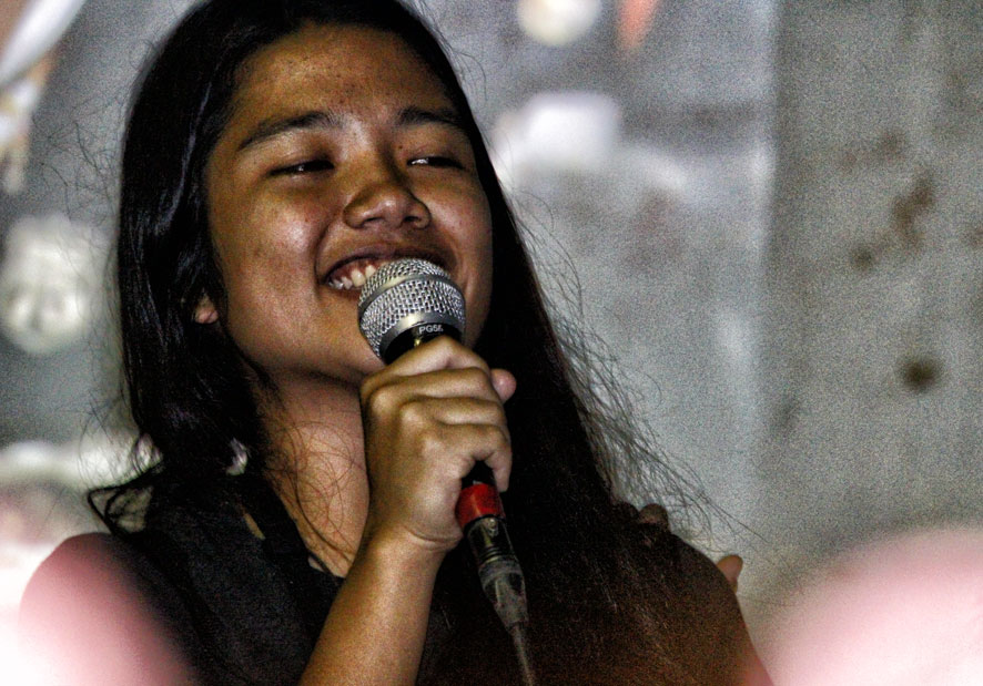 This cultural activist is all smiles as she sings for the Manobo evacuees in a solidarity activity Friday at the evacuation gym in Bankerohan Gym.  Some 500 Manobos will finally   return to their villages in Loreto, Agusan del Sur after their mayor Dario Otaza signed an agreement to stop military operations and help rehabilitations of their farms. (davaotoday.com photo by Medel V. Hernani)