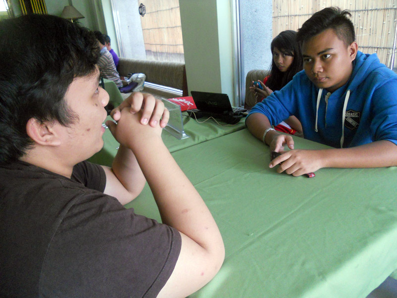 AdZU debater Kelvin Culajara (left) and WMSU's Khaled Lutian (right) with another WMSU debater wait for news to go home as they had stayed for a week already in a hotel in Davao City (davaotoday.com photo by Tyrone A. Velez)