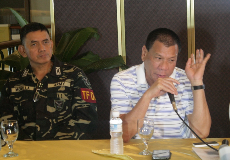 Davao City Mayor Rodrigo Duterte issued an ultimatum to two “persons of interests” to surrender to authorities until Saturday 3 pm.  Authorities are looking for one person who was seen in CCTV footages in both SM and Gaisanom Mall Cinema hours before the blasts, and another person purchasing batteries that was the type used for the bombs. “We would like to talk to you,” the mayor said. (davaotoday.com photo by Medel V. Hernani)