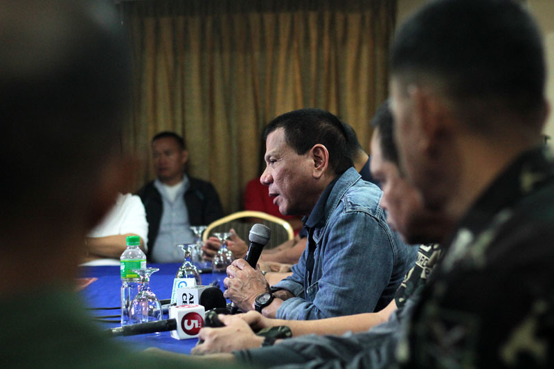 Davao City Mayor Rodrigo Duterte tells media at the city’s command conference at Grand Men Seng Hotel that intelligence information points to a certain group targeting American firms as possibly behind the bombings of two cinemas last Monday night. The mayor came straight from a flight from South Korea early Tuesday dawn. (davaotoday.com photo by Ace R. Morandante)
