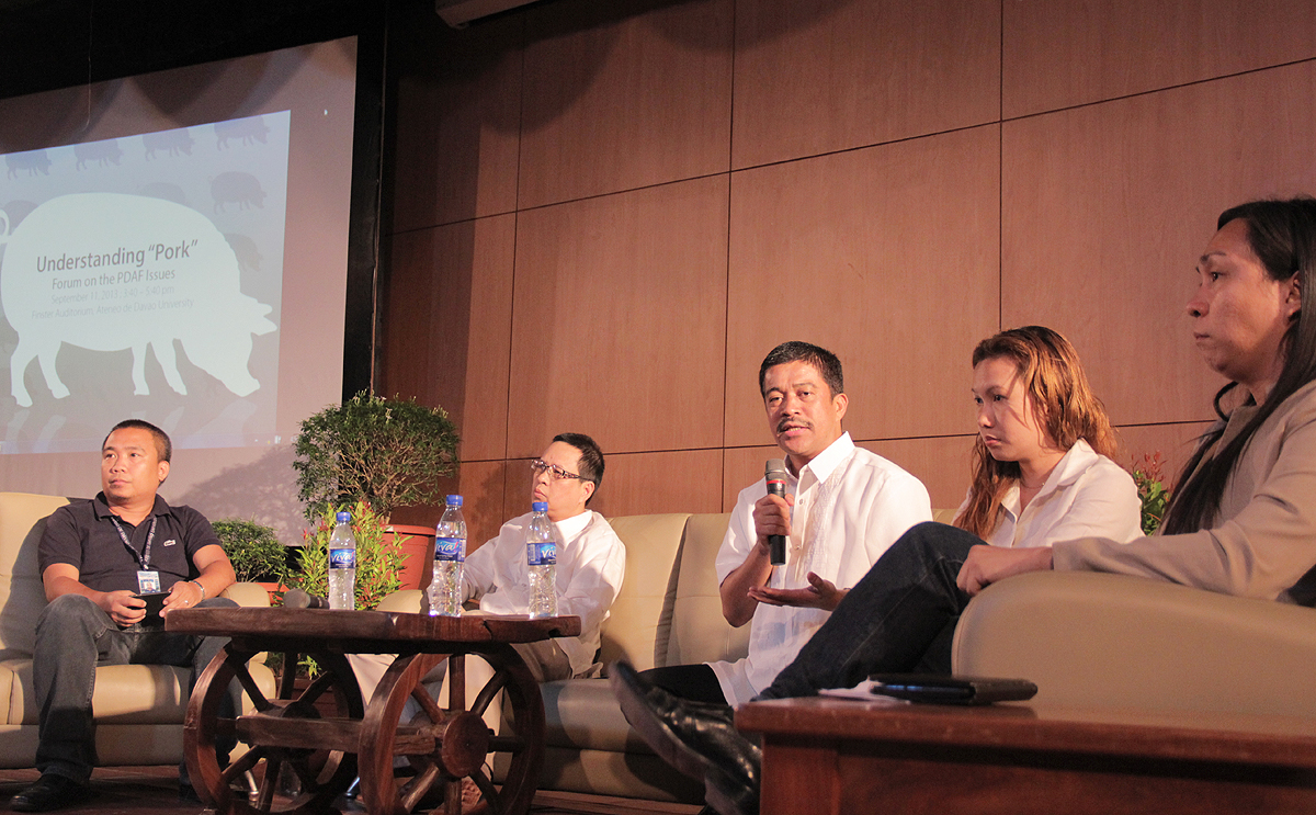 Bayan Muna Representative Atty. Carlos Isagani Zarate (center) stressed the need to abolish both the legislative PDAF and presidential “pork” or special funds in order to stop the culture of patronage politics.  Joining Zarate is Asst. Deputy Ombudsman for Mindanao Atty. Rodolfo Elman (second, left), teachers of Ateneo de Davao University and anti-corruption advocates during Wednesday’s forum on pork barrel held at Ateneo de Davao University. (davaotoday.com photo by Barry Ohaylan)