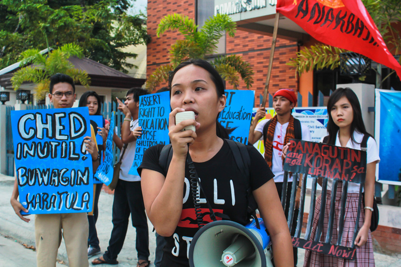 Student activists picketed the regional Commission on Higher Education (CHED) regional office in Obrero on Monday over the alleged anomaly by education officials and budget secretary Butch Abad to fund the P10-billion CHED-PCARI (Philippine-California Advance Research Institute) Collaboration Research Project.  (davaotoday.com photo by Ace R. Morandante)