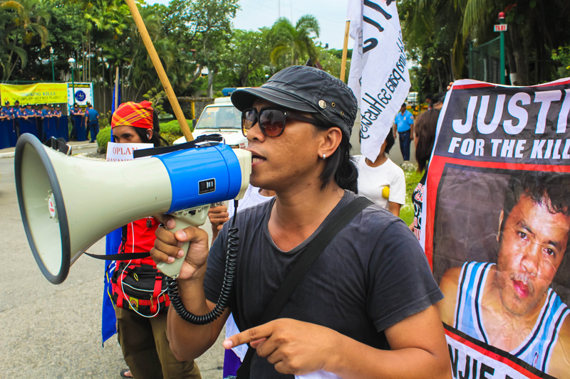 Activists picketed the Armed Forces of the Philippines and Philippine National Police Joint Peace & Security Coordinating Council at the Waterfront Hotel in Lanang, saying the AFP’s military operations resulted to ‘un-peace’ with the displacement of indigenous peoples in Compostela, and the killing of lumad supporter Benjie Planos (in poster) in Loreto, Agusan del Sur. (davaotoday.com photo by Ace R. Morandante)