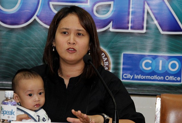 Davao City Councilor Leah Librado-Yap holds her son in hand during Thursday’s I-Speak Forum at City Hall to announce the city’s activities in observance of Children’s Month spearheaded by her committee on women and children. (davaotoday.com photo by Medel V. Hernani)