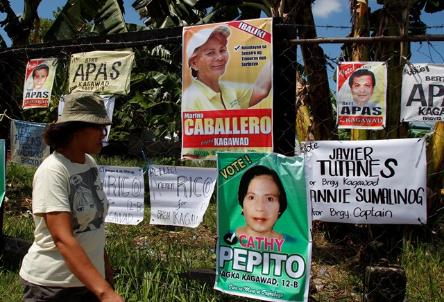 VYING FOR ATTENTION An array of campaign streamers and tarpaulin are seen along a downtown area on Friday at the first day of the Barangay Election campaign.  (davaotoday.com photo by Medel V. Hernani)