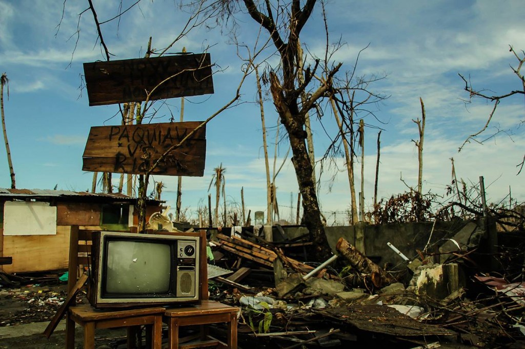 Without electricity and relief in Leyte including this town of Tolosa, a resident still posts a broken television set and sign to show his wish to to watch boxing sensation Manny Pacquiao's fight against Brando Rios last Sunday.  (davaotoday.com photo by Ace R. Morandante)