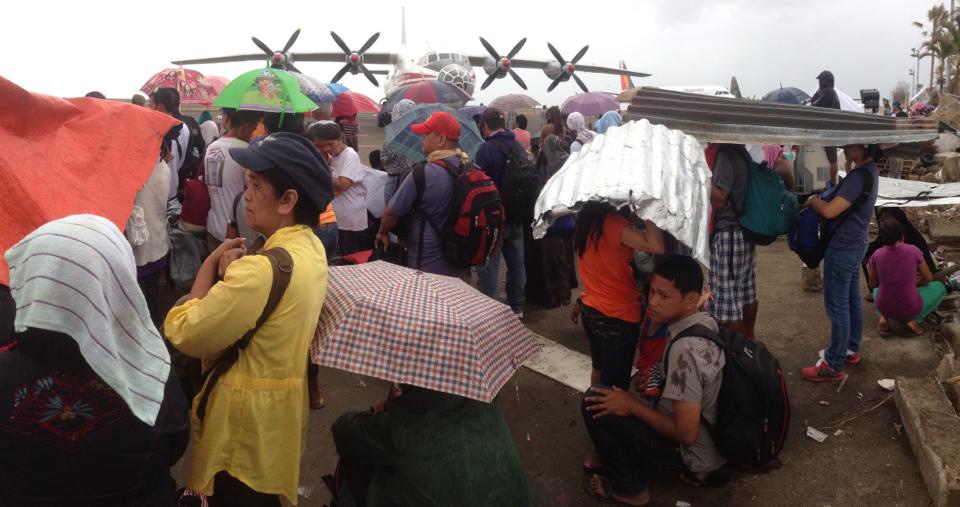 Waiting for their ride out at Tacloban City Airport. (photo courtesy of John Javellana)