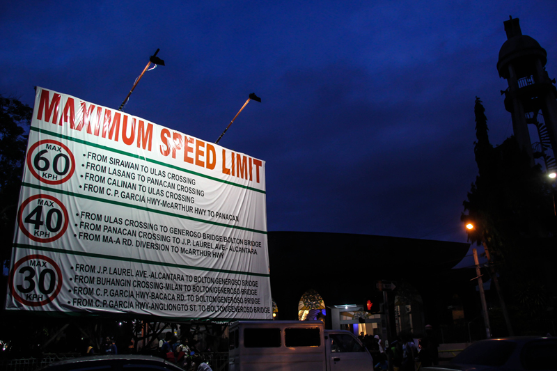 BIG SIGN FOR MOTORISTS A huge billboard in front of San Pedro Cathedral warns motorists on speed limits allowed within the city as set by Executive Order 39. City Mayor Rodrigo Duterte issued the order last October due to concerns from the public on speeding public utility drivers and private motorists engaging in drag race at night. (davaotoday.com photo by Ace R. Morandante)