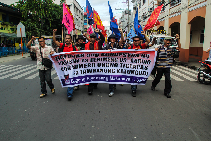 MARCH FOR HUMAN RIGHTS Activists march along the city’s downtown area commemorating the 65th year of International Human Rights Day, as they deplore the continuing impunity under Aquino’s administration with the killings of farmers and military abuses. (davaotoday.com photo by Ace R. Morandante)