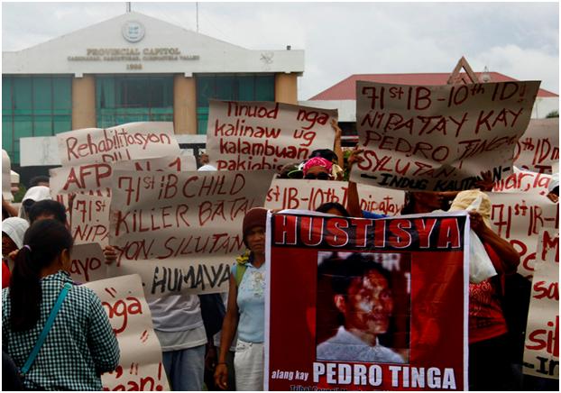 Farmers rally in front of Compostela Valley Capitol grounds Monday demanding justice for slain tribal leader Pedro Tinga. (davaotoday.com photo by Earl O. Condeza)
