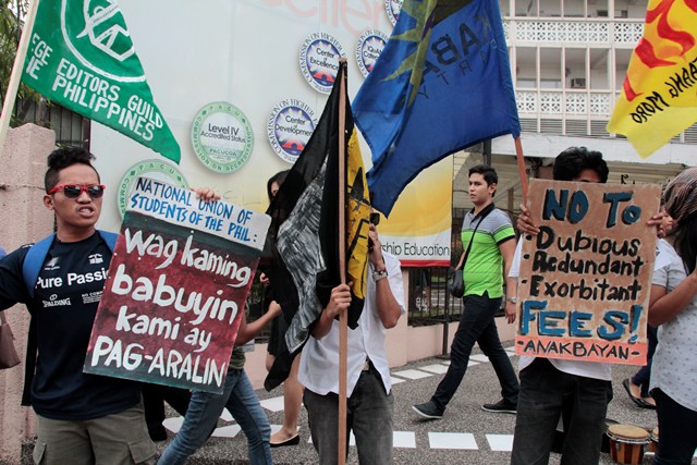 RAGE FOR RIGHTS Student activists staged a protest in front of the University of Mindanao campus during US Ambassador Philip Goldberg's visit in Davao for turnover of USAid projects in Compostela Valley. (Medel V. Hernani, davaotoday.com)