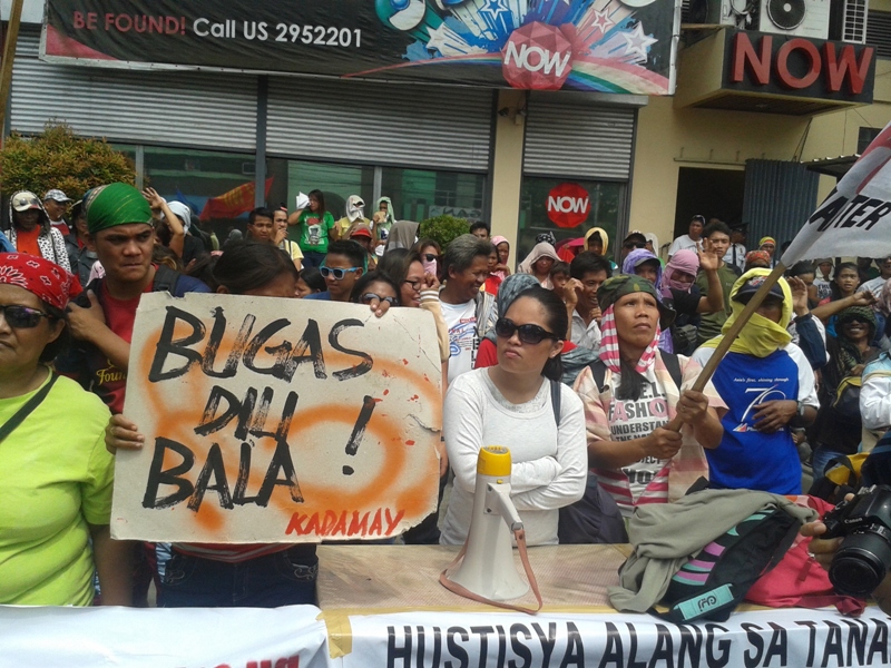 GRIM FACES. Farmers from Compostela Valley showed grim faces at a rally in front of the Commission on Human Rights office Friday to demand for the stop of military operations and support from government for their welfare. (Tyrone Velez/ davaotoday.com)