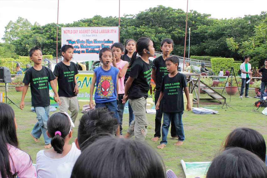 Children organized by the Kaugmaon Foundatoin in a choir performance during the World Day Against Child Labor on June 12 held at Davao City's People's Park.   