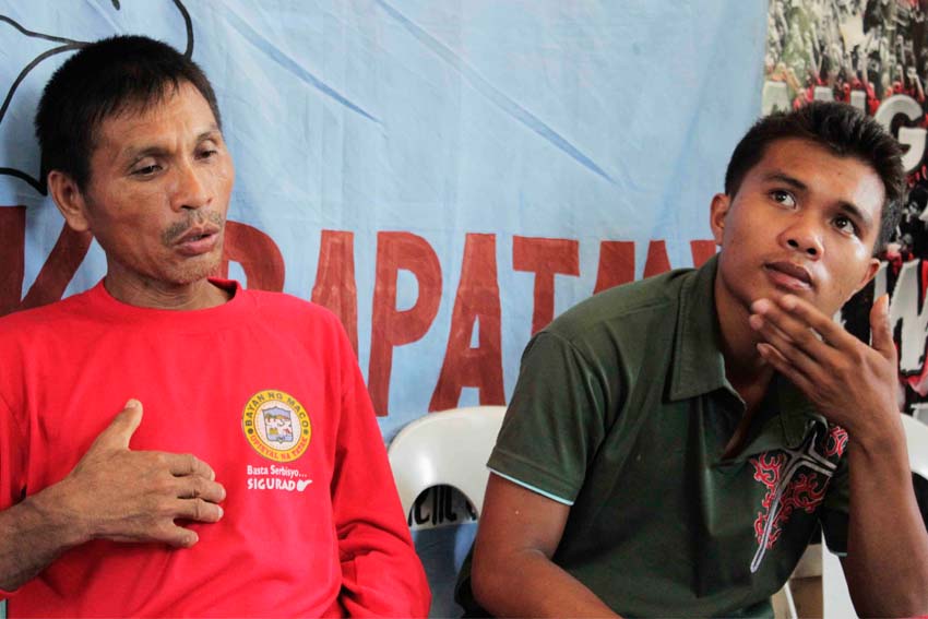 Farmer and barangay leader Pedro Cadungog (left) of Maco, Compostela Valley with son Randil recounts how army soldiers forced them as guides in tracking the New People's Army last June 7, that resulted to them witnessing soldiers killed or injured from a detonated blast. 