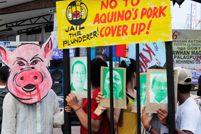 Activists during an Independence Day rall in Davao call out to President Aquino to stop protecting allies and prosecute all government officials involved in the pork barrel scam. (contributed photo by Jaja Necosia)