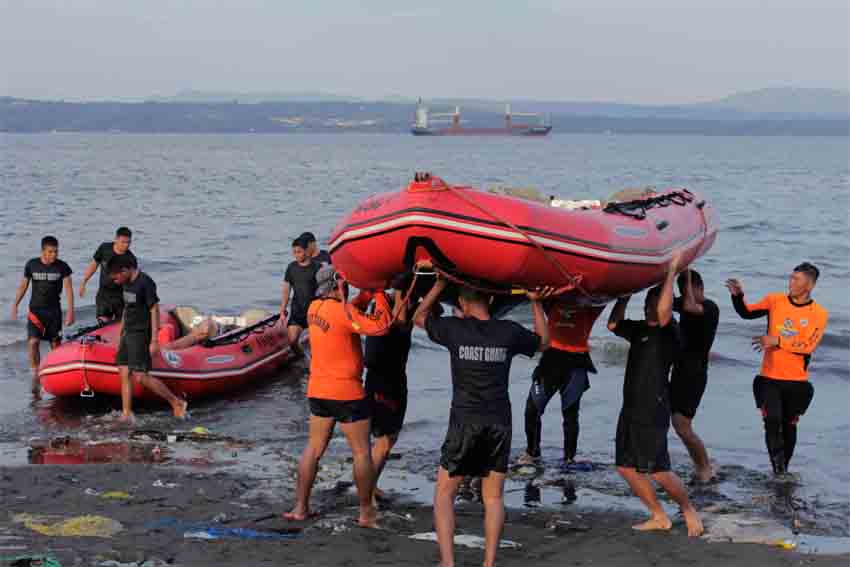 Members of the Philippine Coast Guard conduct a rescue drill along the shore in Santa Ana wharf in preparation for possible calamities in the region.  