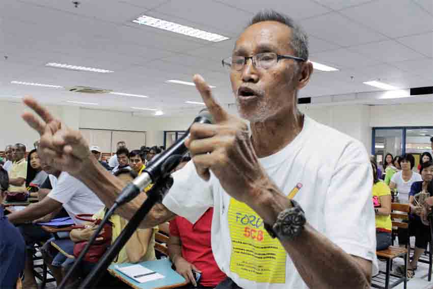 Avelino Ignacio, an urban poor leader from Agdao, recalls his two sons were killed by state elements during Martial Law on Friday’s forum at Ateneo de Davao University on compensation claims for Marcos’ victims.