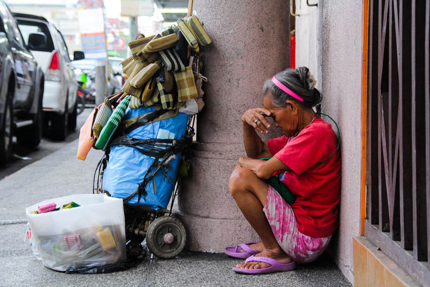 A vendor takes time for an instant nap in Bolton's sidewalks.