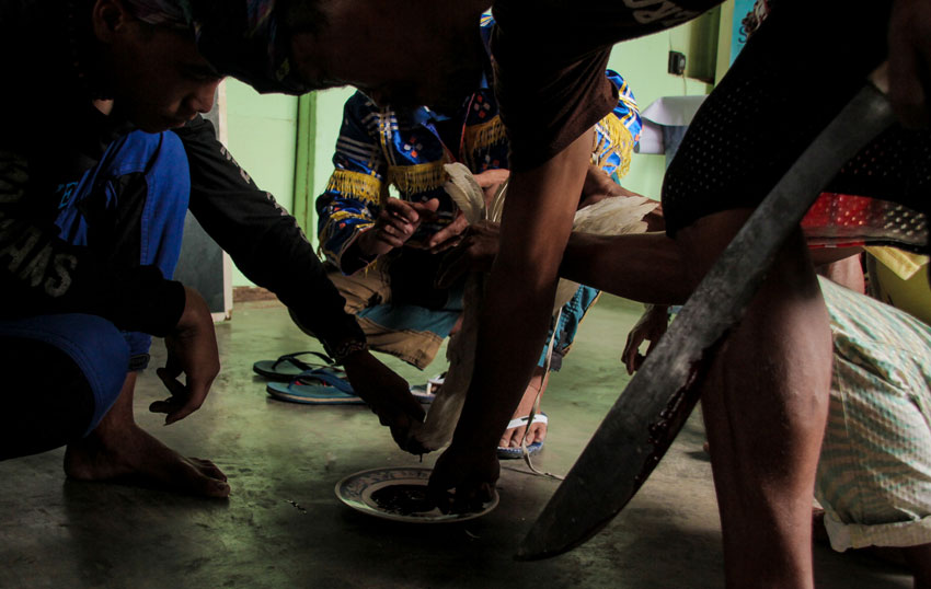 Members of Lumad group Karadyawan hold a ritual called "Panubadtubad" to urge armed paramilitary fanatics led by Datu Laris Mansaloon to stop the harassments in Brgy. Gupitan, Kapalong, Davao del Norte.