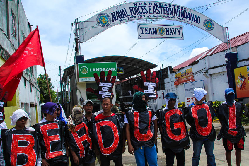 Union workers from Compostela Valley Province rallied outside the entrance of the Armed Forces' Eastern Mindanao Command criticizing alleged military harassment on their leaders.