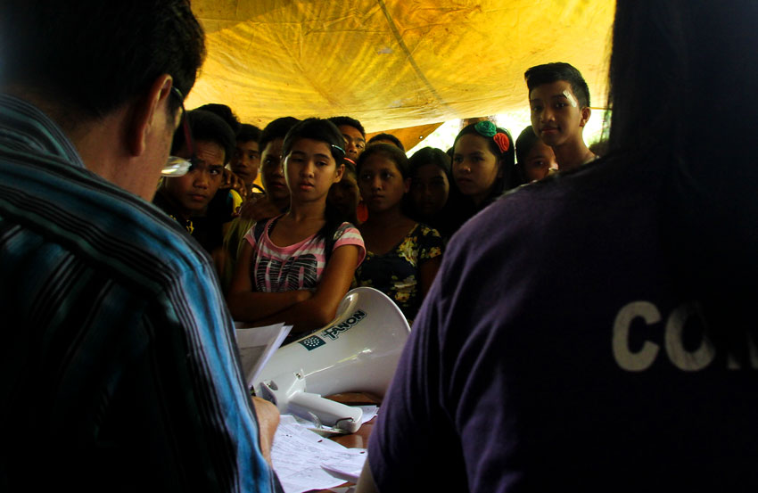 Several teenagers wait for their names to be called for the Sangguniang Kabataan voters’ registration during the last day of filing at the Comelec regional office today.