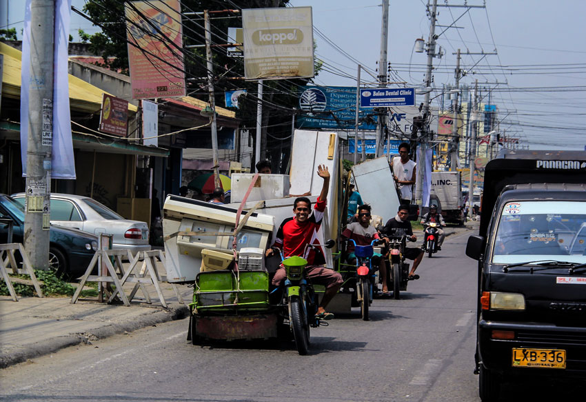 If there’s a will, there’s a way. These vendors can make use of any junk. Aboard their improvised motorbikes they were off to sell collected junk appliances along R. Castillo St., Agdao, Davao City, Friday.