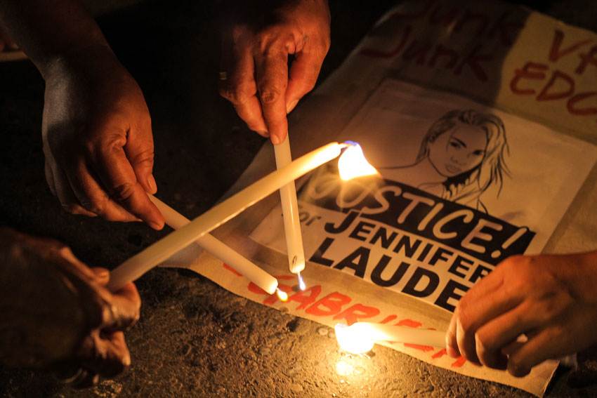 Women's group Gabriela lights candles to call for justice to slain Filipino transgender, Jennifer Laude. The group also calls for the abolition of the Enhanced Defense Cooperation Agreement and the Visiting Forces Agreement with the US military. (Ace R. Morandante/davaotoday.com)