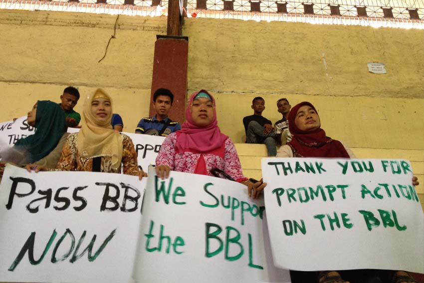 Moro women in Cotabato City display appeal for support to House Bill 4994, or the Bangsamoro Basic Law, outside the Cotabato City State Polytechnic College where a public hearing is conducted October 23.  (Mart D. Sambalud/davaotoday.com)