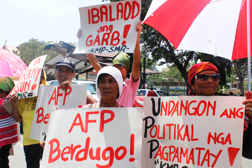 FARMERS' PROTEST. Farmers condemn killings and human rights violations allegedly perpetrated by state forces against their ranks today along San Pedro Street in Davao City as part of a nationwide protest in commemoration of the Peasant month. (Medel V. Hernani/davaotoday.com)