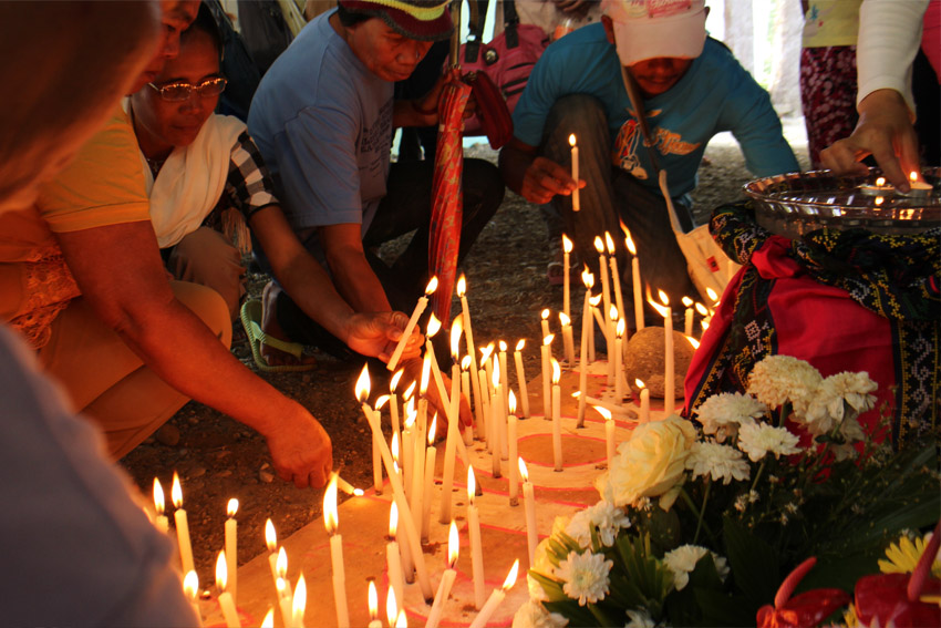 Supporters of slain Italian priest Fr. Fausto Tentorio light candles in a pattern of his nickname "Pops" to call for justice. Tentorio was slain three years ago by suspected paramilitary elements in his church in Arakan Valley, North Cotabato. (John Rizle L. Saligumba/davaotoday.com)
