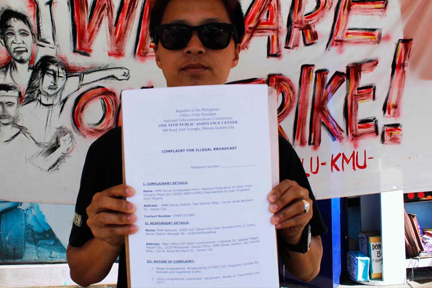 Gina Hitgano, president of the striking Radio Mindanao Network  Davao Employees Union files the union complaint before the National Telecommunication Commission against the management for alleged illegal airing of radio broadcasts and using studio and transmitter equipment not licensed and unregistered with the NTC.