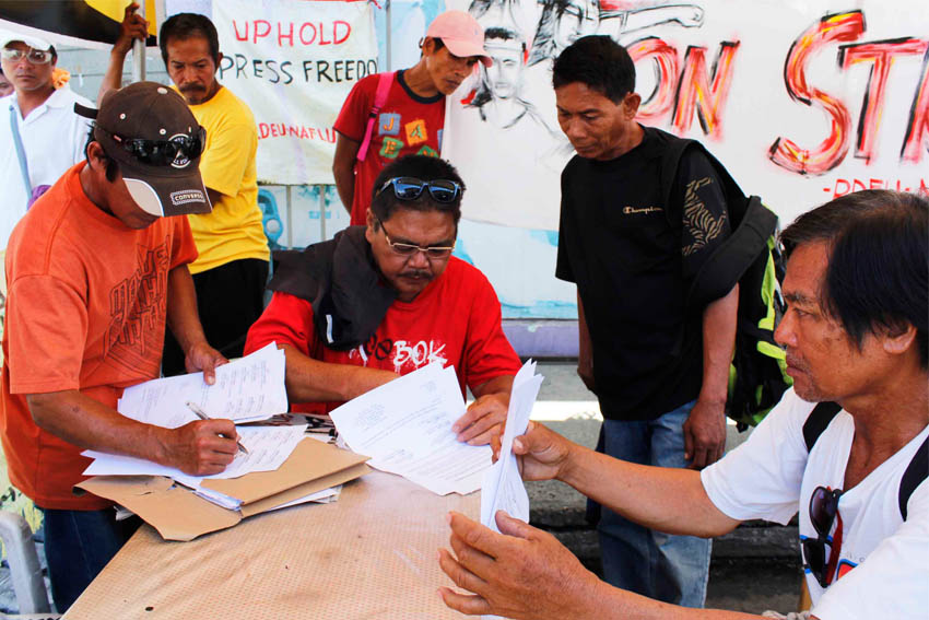 23 workers in a banana packing plant in Brgy. Pantaron, Sto. Tomas, Davao del Norte seek assistance from National Federation of Labor Union- Kilusang Mayo Uno Saturday after the management refused them entry for alleged "dereliction of duty". The workers refused to work beyond eight hours because they are not paid for their overtime work. (Medel V. Hernani/davaotoday.com)